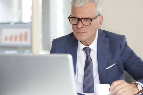 depositphotos_170655934-stock-photo-senior-financial-businessman